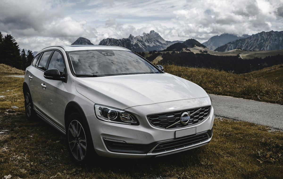 White SUV on a mountain road